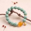 0c0058ce-5c9c-4f20-8db7-b245b8018516.jpg Turquoise & Gold Bead Bracelet - Handmade Mala with Filigree Charm