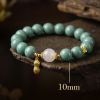 3ad5f3cb-5ba8-4125-b990-f14323a6e8b5.jpg Teal Meditation Bracelet - Handcrafted Mala with Peanut Pendant