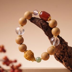 93b90e55-2e7e-4540-8e4e-ec18d79c1c4c.jpg Mixed Bead Mala Bracelet - Handcrafted with Carved Charm & Gold-Tone Spacers