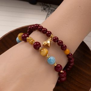 d27bcb62-4dcc-48fe-99da-a6776f9fdb0e.jpg Multi-Color Chinese Bracelet - Red, Amber & Blue Beads with Gold Zodiac Charm