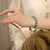 fdf97095-18c4-41a2-abbd-b0b9c9892230.jpg Teal Meditation Bracelet - Handcrafted Mala with Peanut Pendant